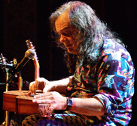 David Lindley playing a Weissenborn slide guitar. Photo by Joerg Kliewe.